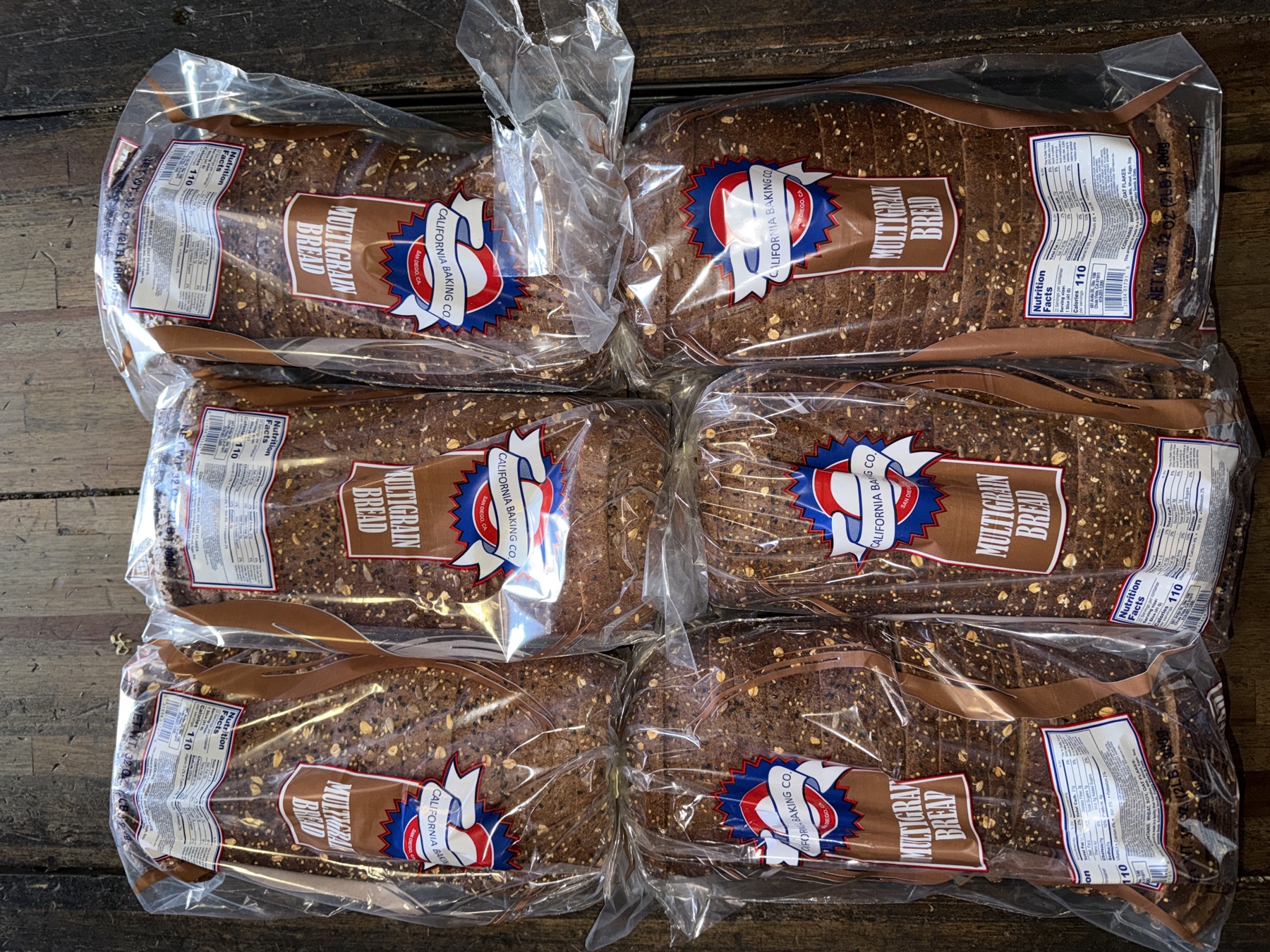 Whole wheat bread loaves in clear bags